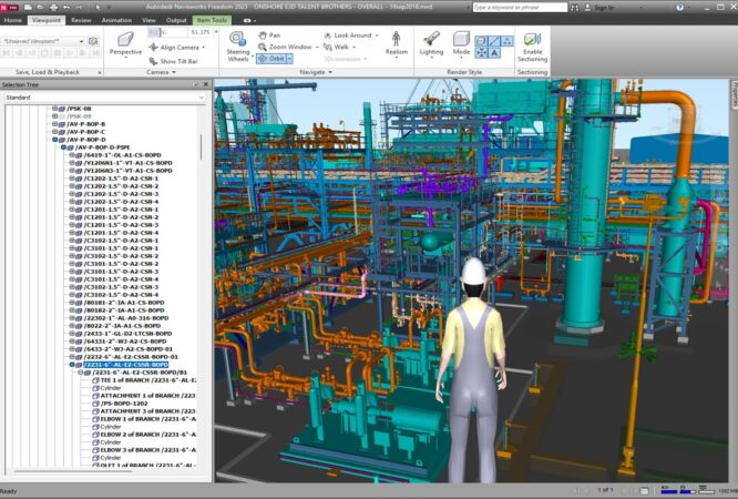 3D model of an industrial plant with colorful pipes and equipment; a worker in a hard hat stands in the foreground, viewing the scene.
